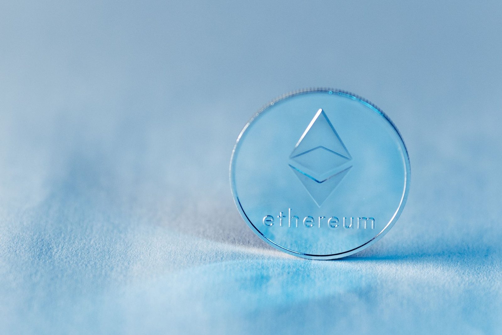 Close-up of a transparent Ethereum coin symbolizing blockchain technology and modern finance.