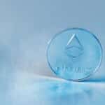 Close-up of a transparent Ethereum coin symbolizing blockchain technology and modern finance.
