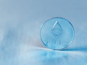 Close-up of a transparent Ethereum coin symbolizing blockchain technology and modern finance.