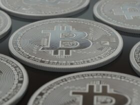 Detailed close-up of silver Bitcoin coins showcasing digital currency concepts.