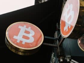 Close-up view of outdoor bitcoin symbol signs, reflecting modern cryptocurrency trends.