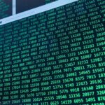 Vibrant green numbers on a computer screen, showcasing binary code and data streams.