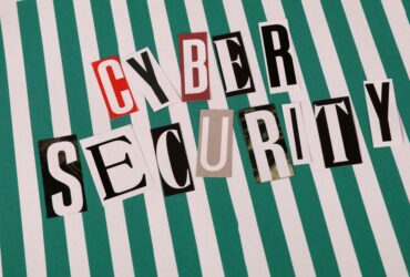 Cyber security concept depicted with a creative text collage on striped background.