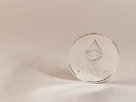 Close-up of an Ethereum coin on a soft, neutral background symbolizing modern cryptocurrency.