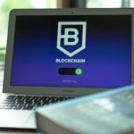 Laptop with blockchain application interface connecting. Ideal for tech and crypto themes.