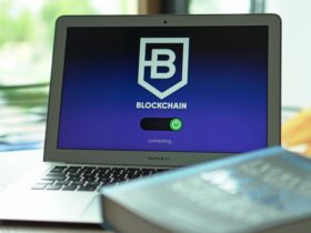 Laptop with blockchain application interface connecting. Ideal for tech and crypto themes.