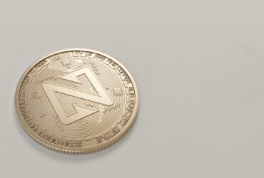 A detailed close-up image of a Zcoin cryptocurrency against a neutral background.
