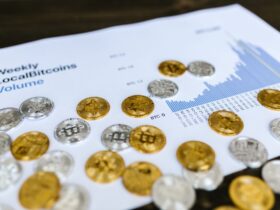 Gold and silver Bitcoin coins placed on a graph showing LocalBitcoins trading volume analysis, symbolizing cryptocurrency market trends.