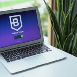 A modern laptop on a desk showing a blockchain interface, ideal for cryptocurrency topics.