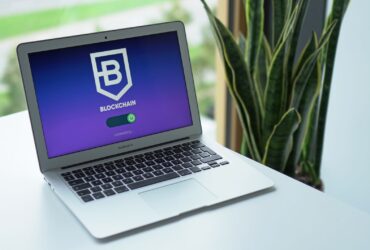 A modern laptop on a desk showing a blockchain interface, ideal for cryptocurrency topics.