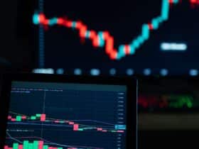 Detailed view of cryptocurrency trading charts on digital screens, showcasing market fluctuations.